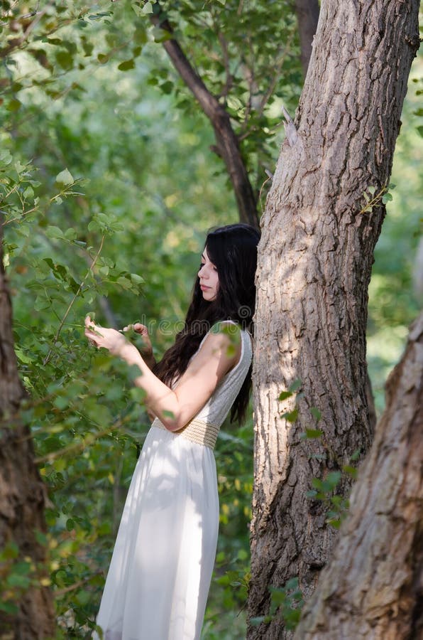 A Woman With Long Hair Wearing A White Dress A Woman With Long Hair Wearing A White Dress