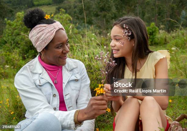 Mom And Daughter In An Intimate Moment Of Inner Connection Stock Photo