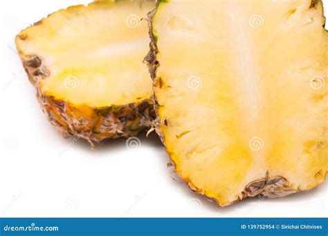 Sliced Pineapple Is Ready To Eat On The Isolated White Background With